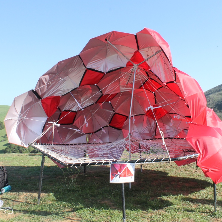 A structure composed of mostly umbrellas.